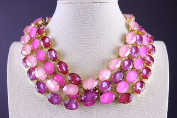Layered statement necklace featuring pale pink, baby pink, fuchsia, and raspberry berry wine oval crystals in Georgian collet settings, inspired by Anna Wintour’s iconic vintage style.
