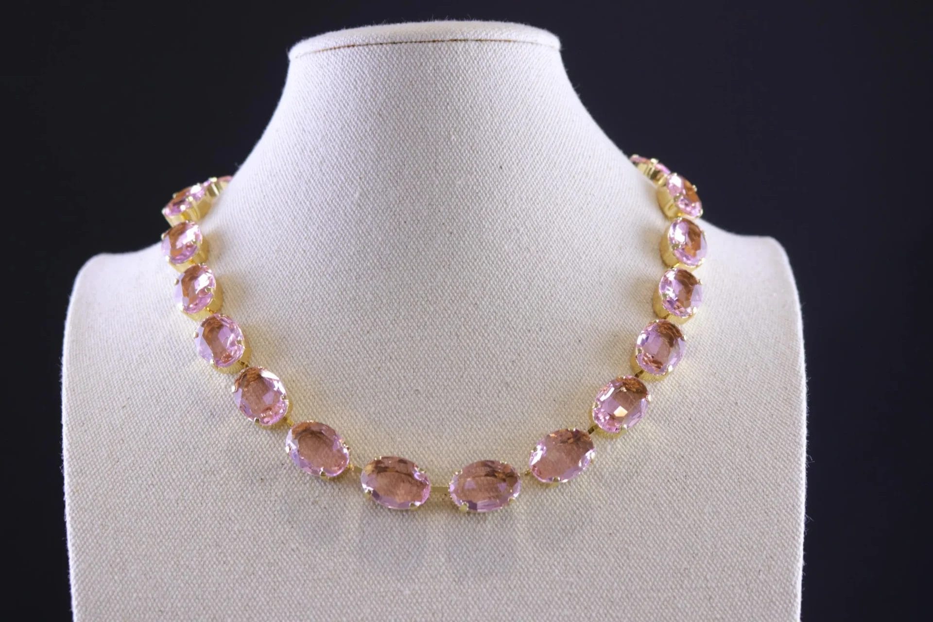 Elegant pale pink crystal necklace featuring faceted oval stones in a warm blush tone