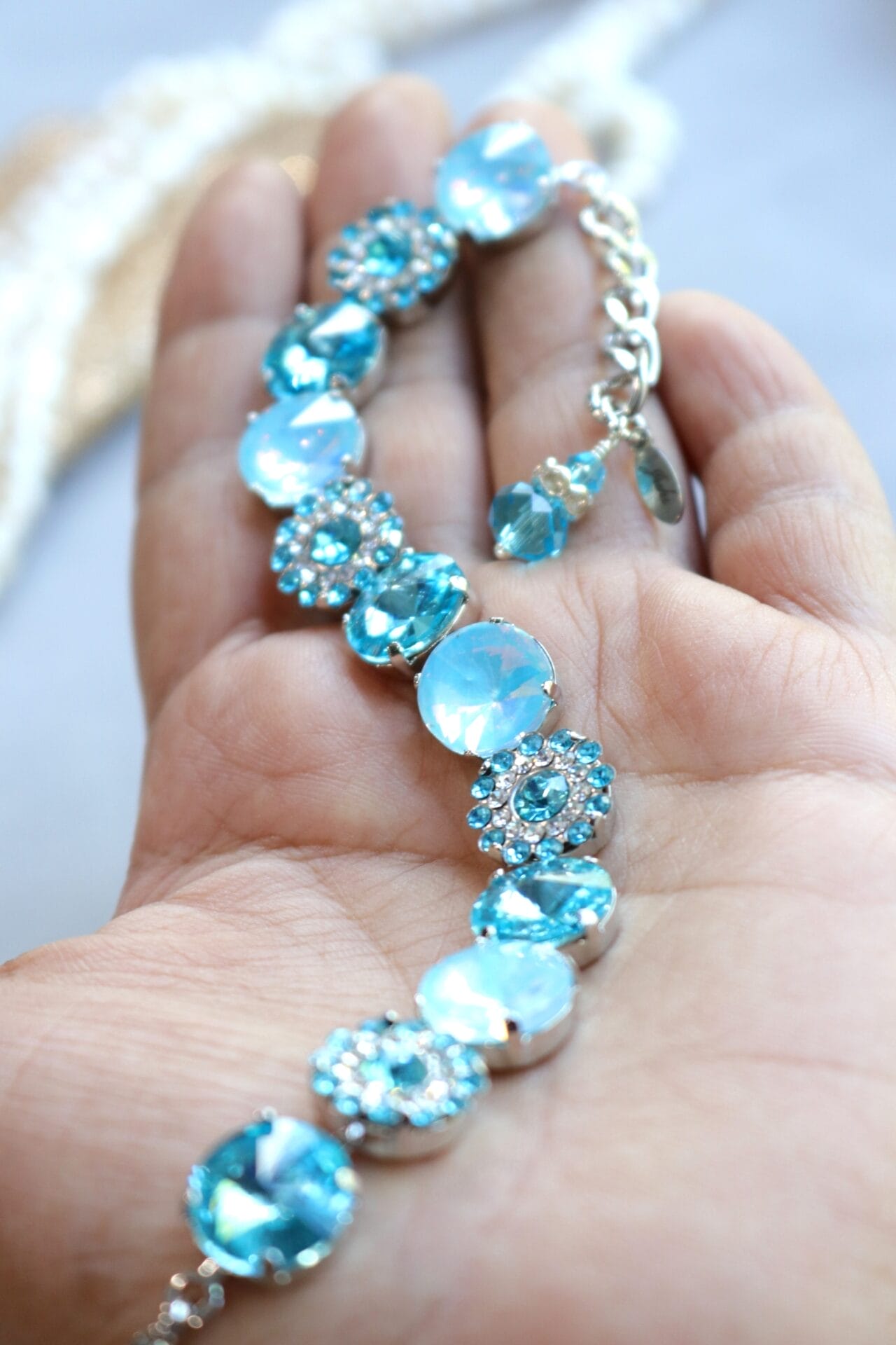Adjustable silver bracelet with aqua crystals and flower rhinestones