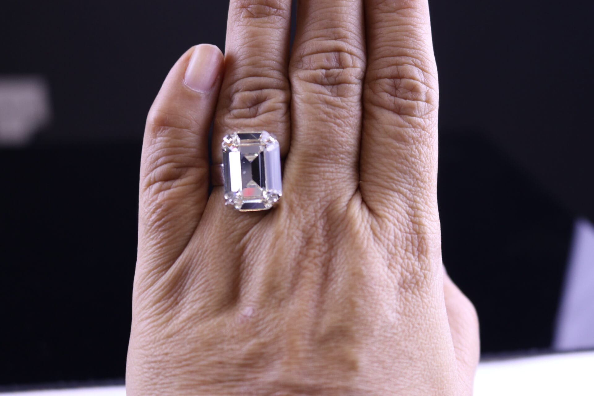 Emerald-cut clear Austrian crystal ring with diamond-like sparkle. Adjustable gold or silver band.