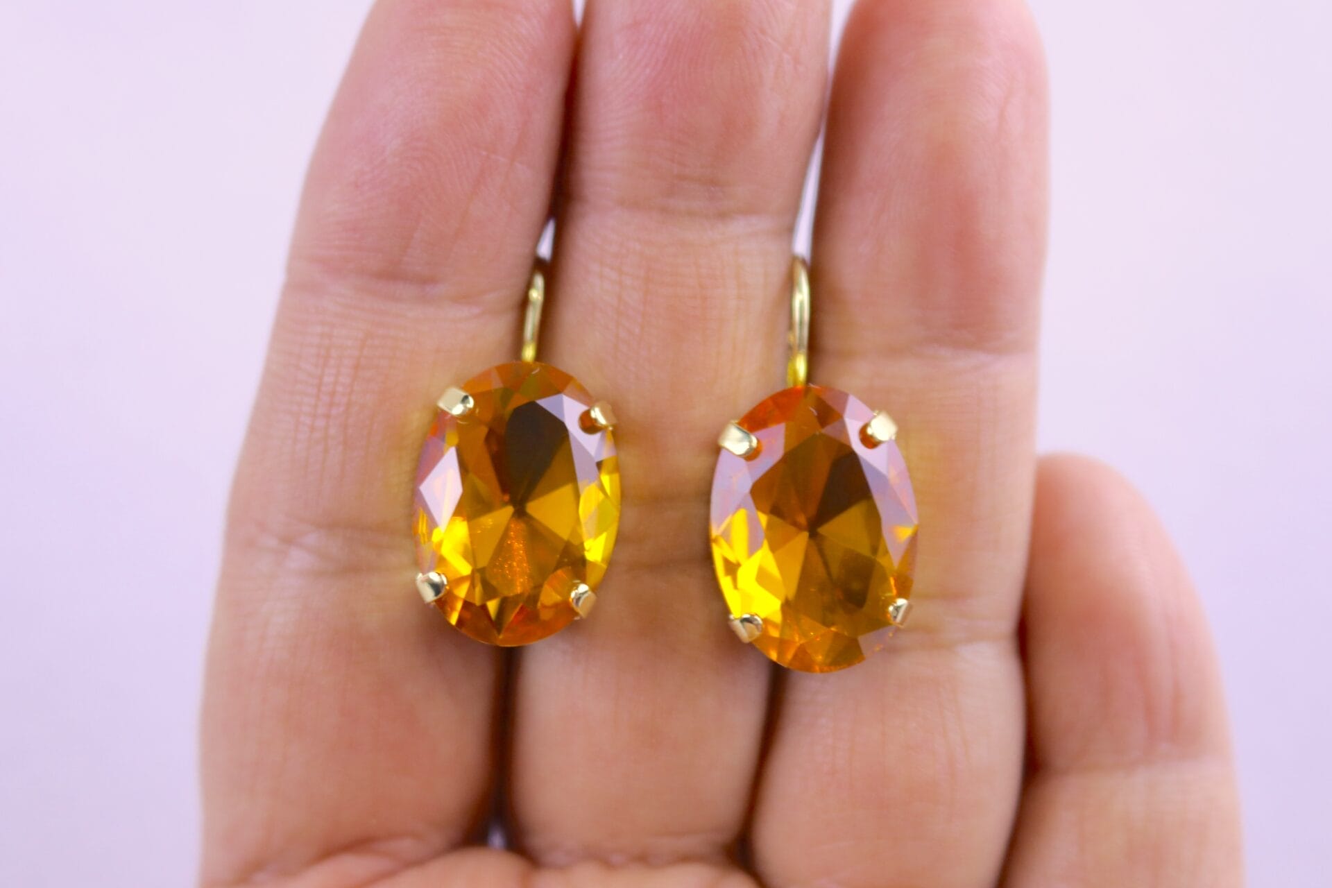 Golden topaz yellow oval gemstone earrings in classic setting