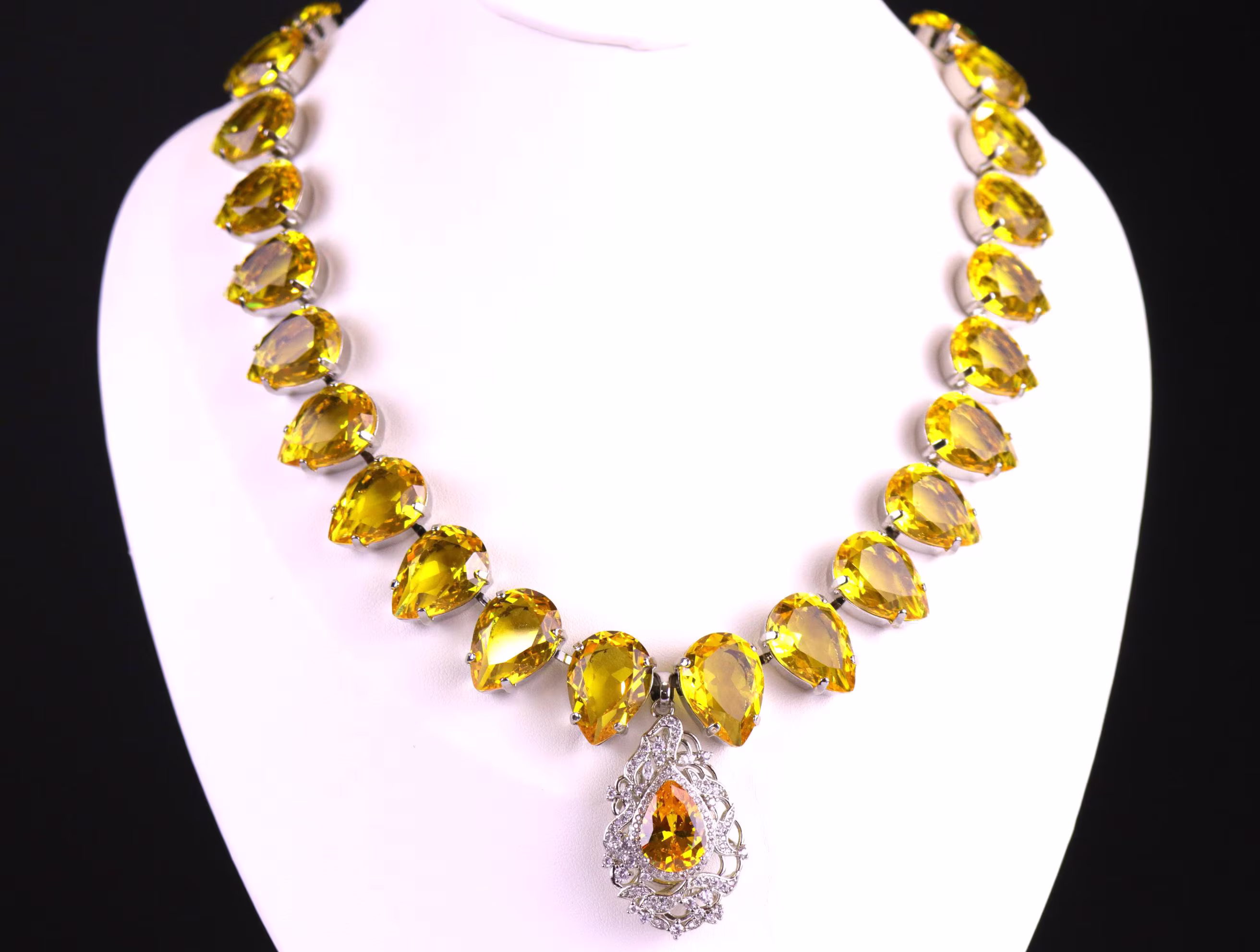 Sabyasachi and Anna Wintour-inspired yellow crystal necklace with elegant pear-cut stones and a dazzling topaz pendant centerpiece.