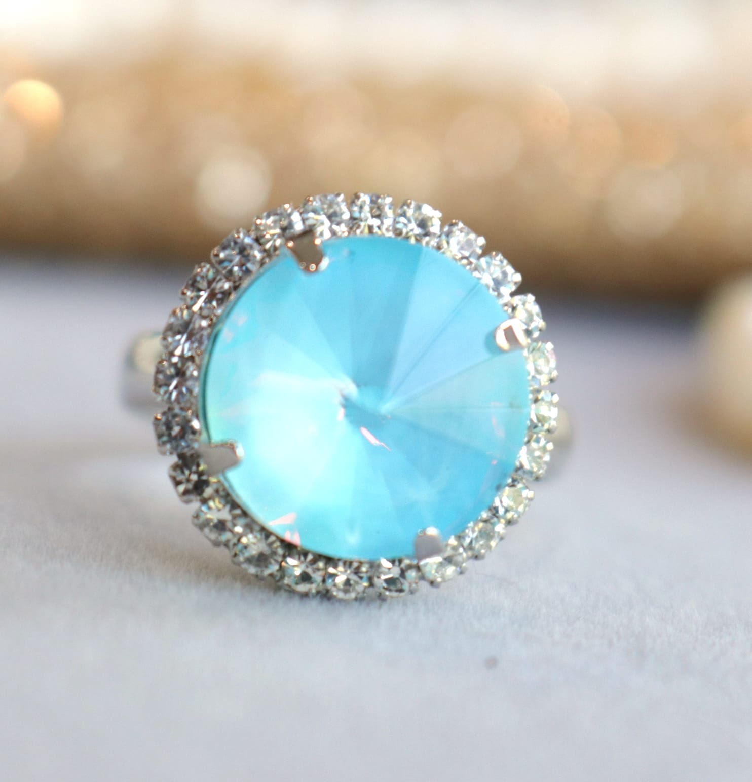 Iridescent opal blue halo ring with 12mm crystal CZ in silver or gold